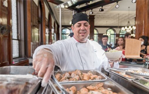 Chef Mike from Columbia Dining serving food